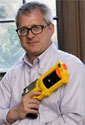 Professor John Sahr posing with nerf gun