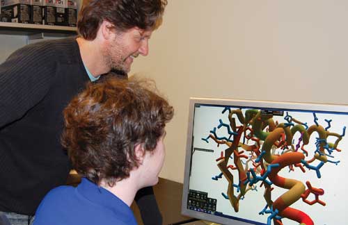 Associate professor Zoran Popovic and student with Foldit game