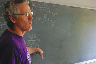 Math Academy instructor at the blackboard