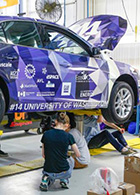 students working on, around, under UW EcoCAR2