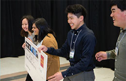 CSNE researchers examine flexible neural recording fibers. Photo credit: Matt Hagen/UW Buerk Center for Entrepreneurship