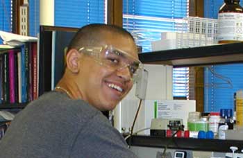 student with goggles in lab student with goggles in lab