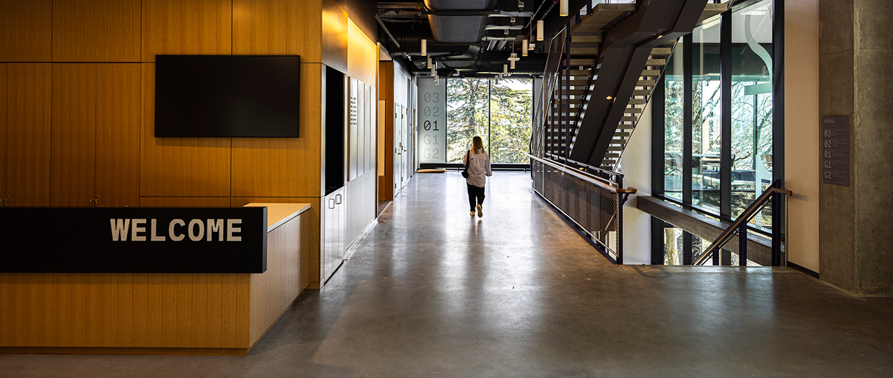 Woman walking in a hallway at the IEB