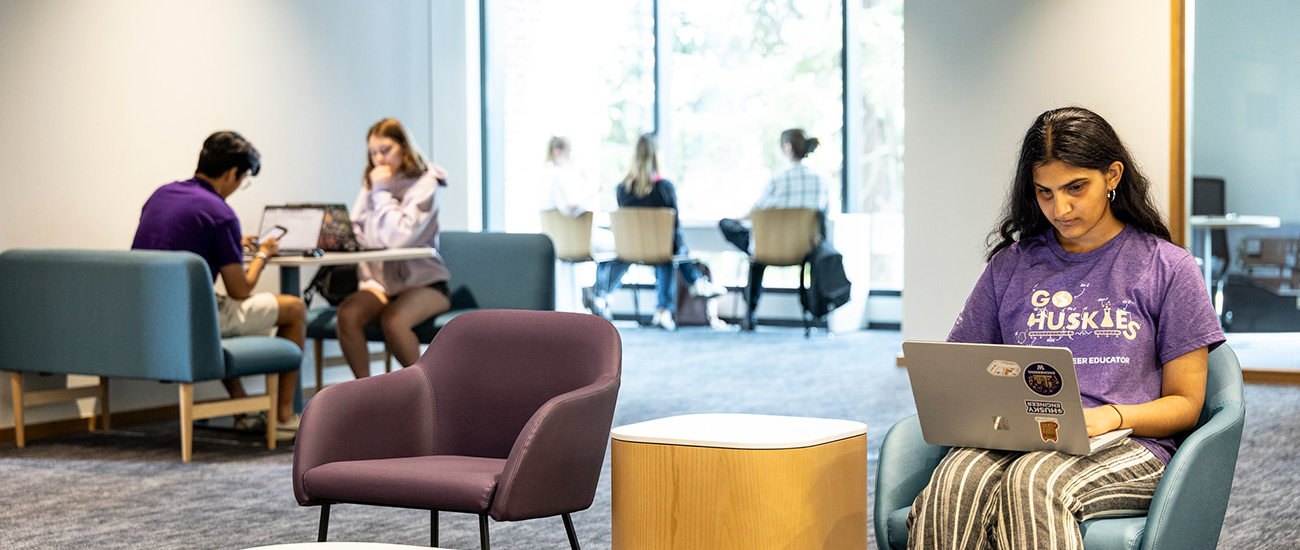Students sitting in an open space within the IEB