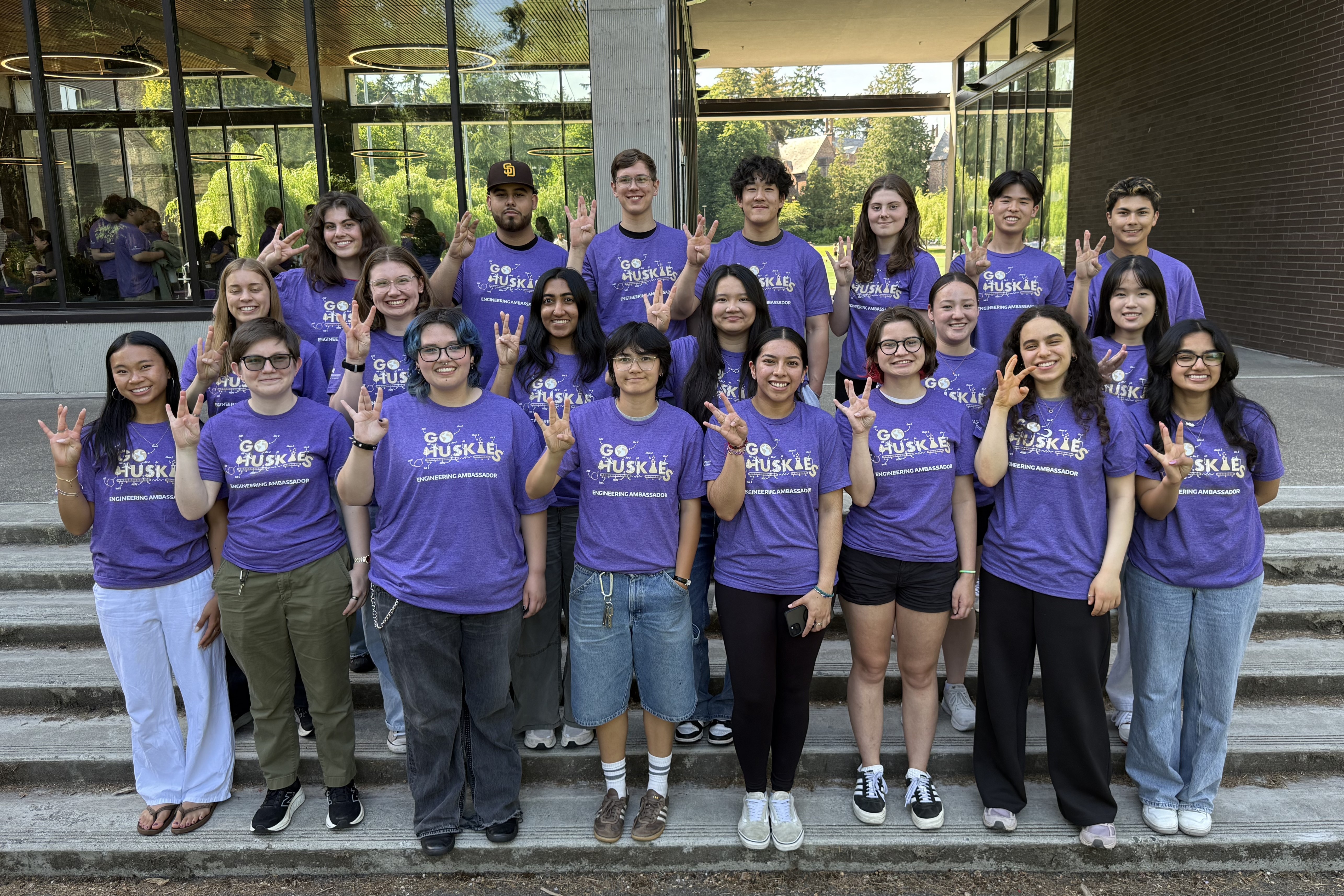 Group photo of Engineering Ambassadors outside in matching purple t-shirts.