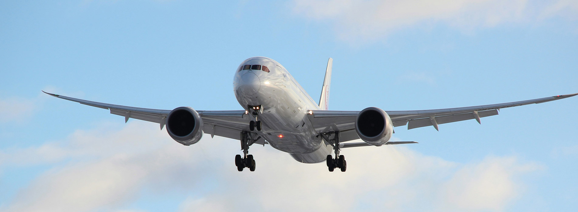 airplane flying through a clear sky