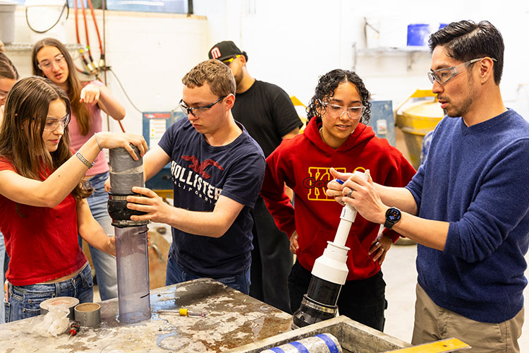 Students working alongside faculty member in Construction Materials lab