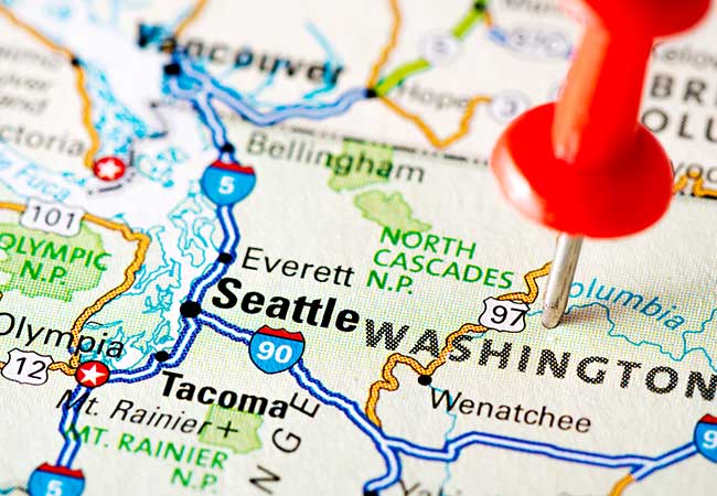 Close-up of map showing major interstates near Seattle. A red pin is sticking out of the map representing a stopping point.