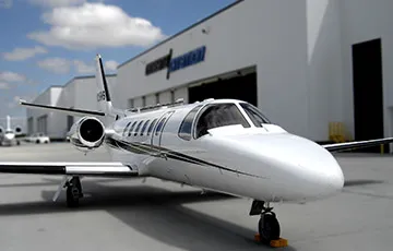 airplane outside a hangar