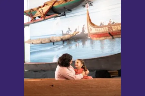Image of a woman holding a young child