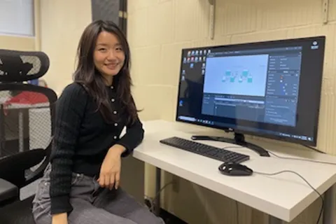 Jiaxin Li sitting at a computer desk