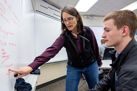 Student receiving in-person tutoring support from the Engineering Academic Center staff
