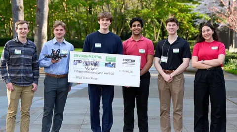 Voltair team holding up winning $15,000 check