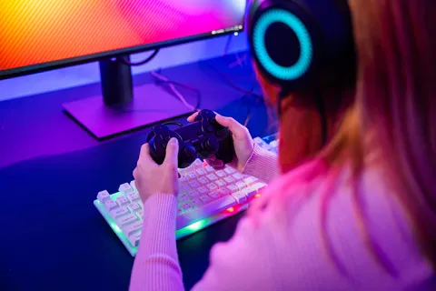 Girl gaming with a controller