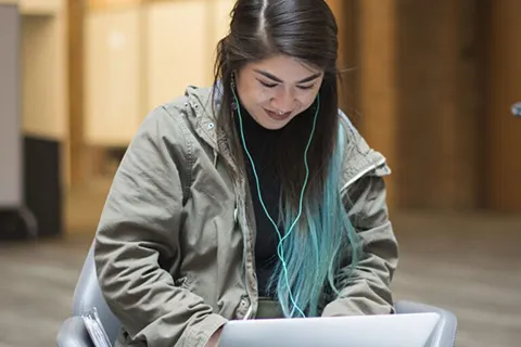 Woman studies on a laptop