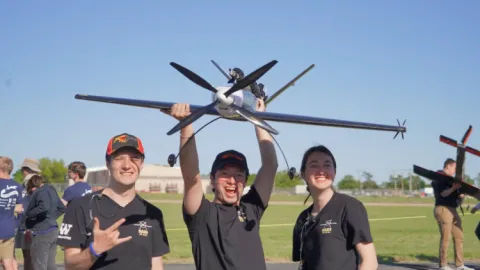 Technical Director Kaleb Shaw with Alejandro Santana and Natalie Hagerman on the tarmac with The Mako.