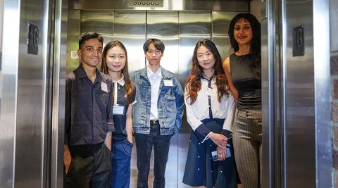 Industry capstone team standing inside elevator