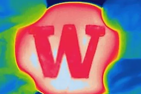 The colorful thermal imaging of a material with the letter W on it is shown