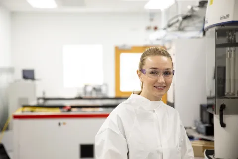 ME grad student Elizabeth Rasmussen sitting in a lab