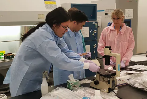 Graduate student Ty Higashi at a NASA lab working on the heart tissue space flight experiment in preparation for the launch