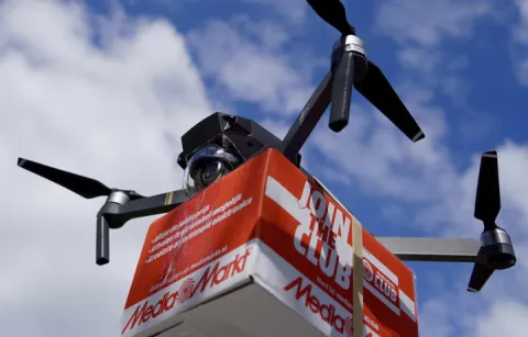 Drone carrying package