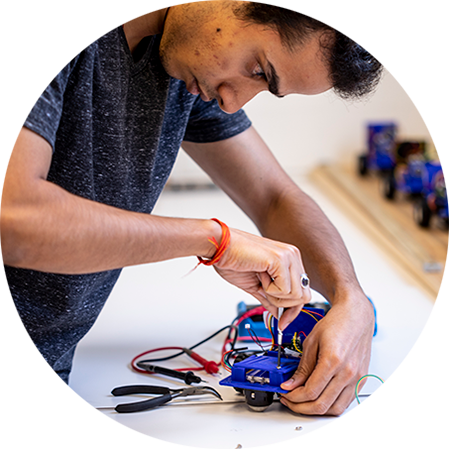 s student working on a model car