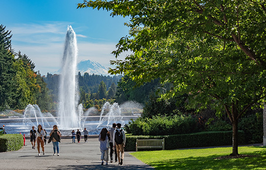 students walking by the Drumheller Fountain