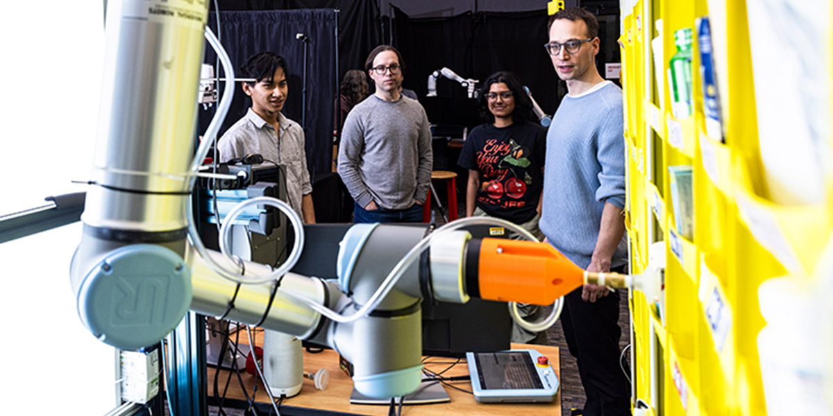 Students and researchers working at robotics lab