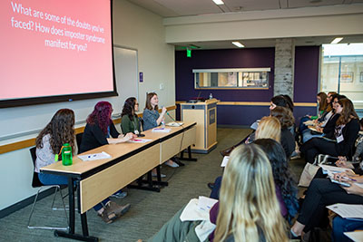 Guests listening to a workshop panel