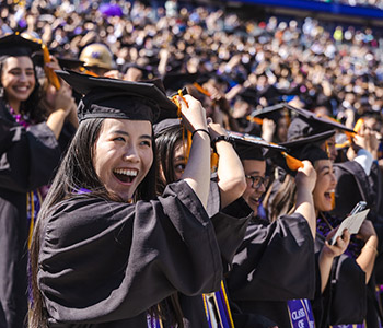 Students at commencement wearing graduation caps