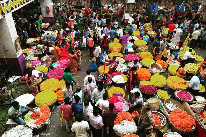 An Indian outdoor market with colorful displays