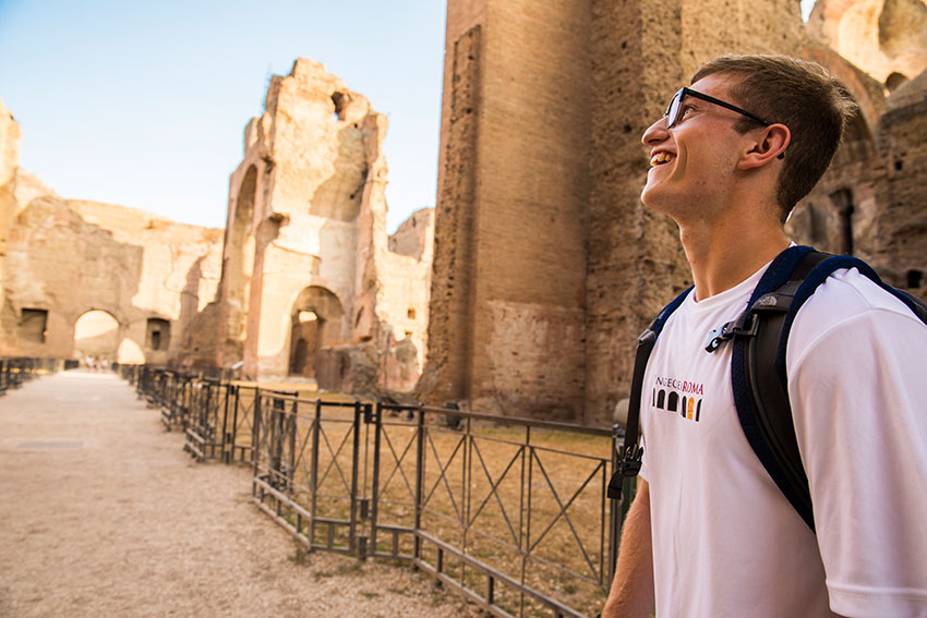 A student marveling at ancient Roman ruin