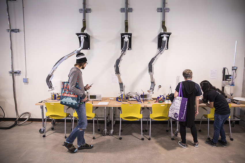 three students in a makerspace