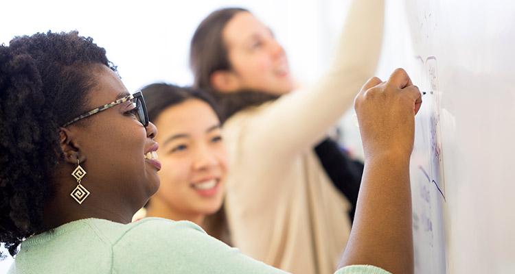 Faculty and students learning in clasroom