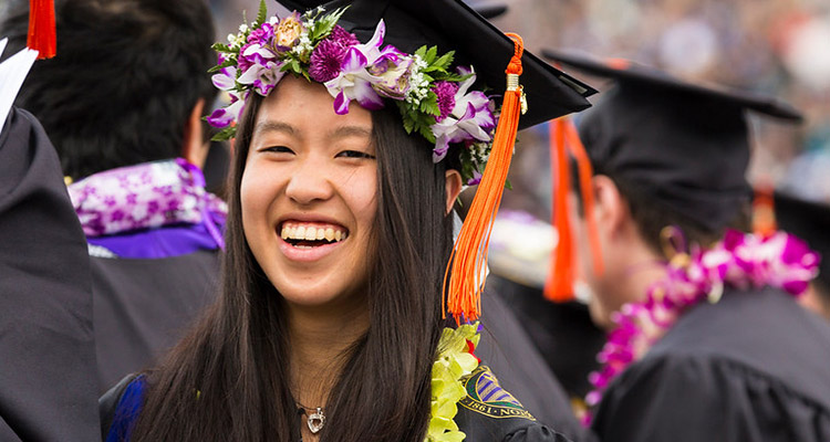 Engineering student at graduation wearing cap and gown
