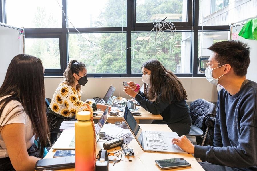 Group of students collaborating in a classroom