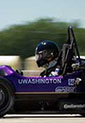 Patrick Sodt at wheel of speeding Formula SAE car