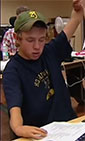 DO-IT student raises hand in class