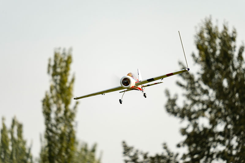 A small aircraft flying in the air