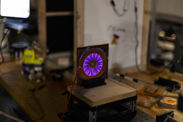 a purple light on a square object
