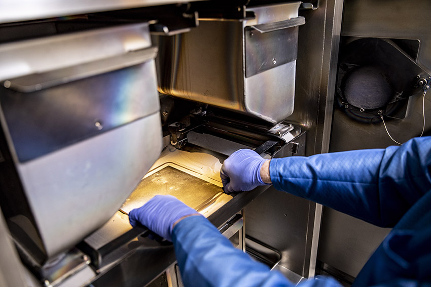 A lab engineer prepareing the print area