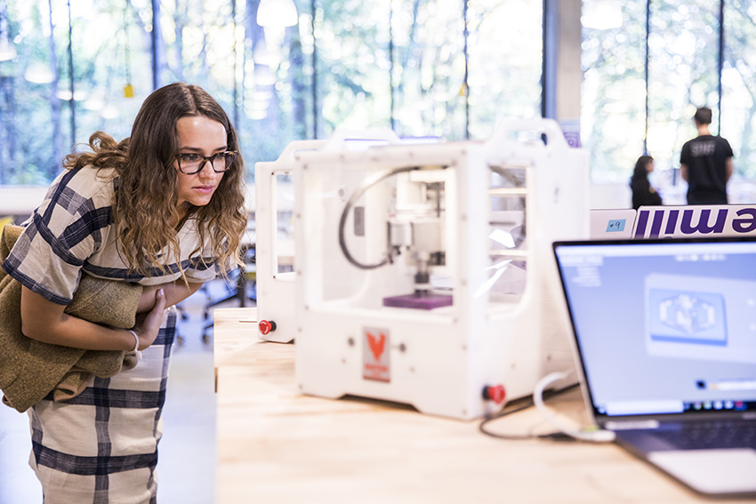 student looking at some equipment