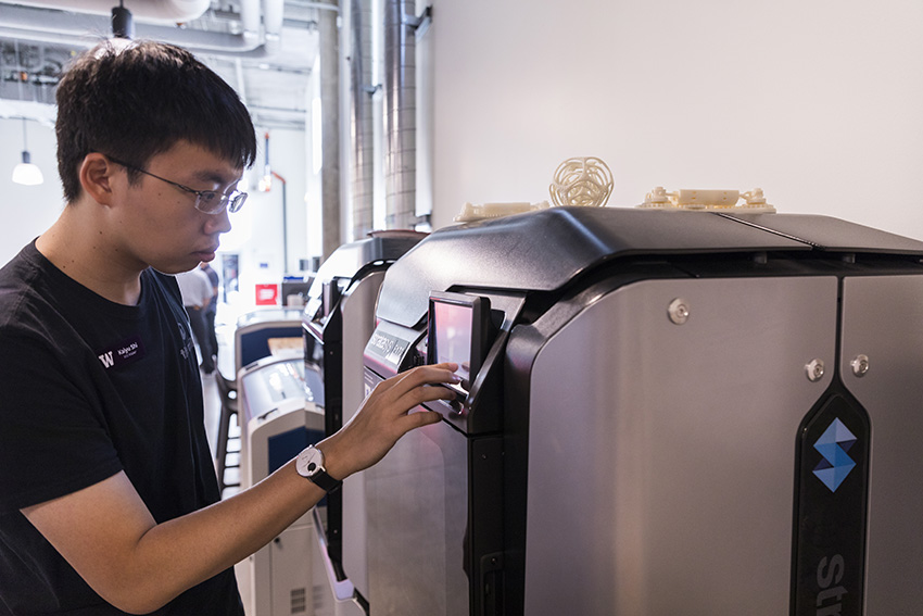 a student with the Stratasys F170 printer