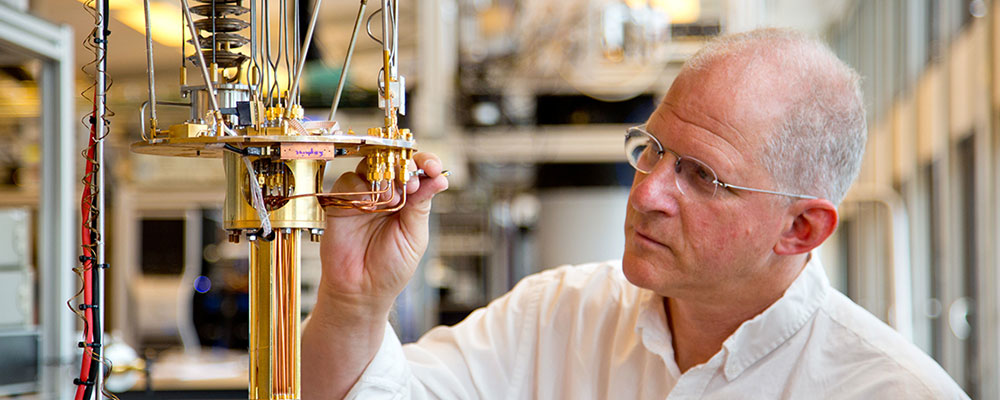 Professor Charles Marcus makes adjustments on equipment in his lab at the Niels Bohr Institute in Copenhagen, Denmark.
