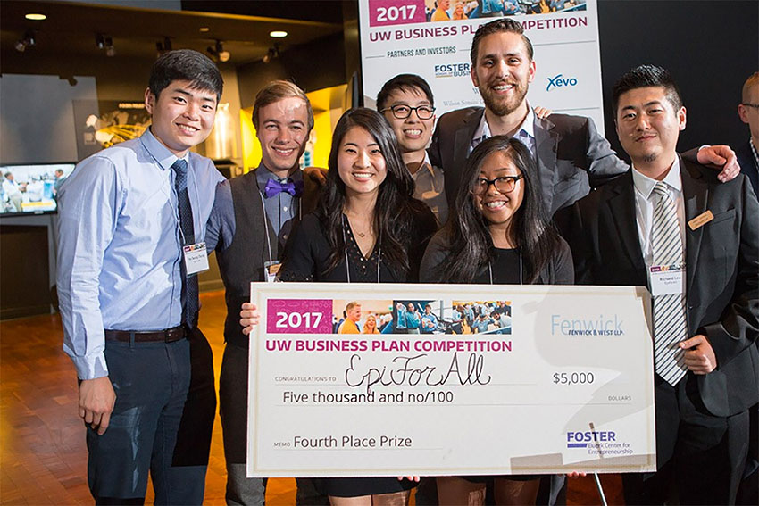 group of students holding a big check