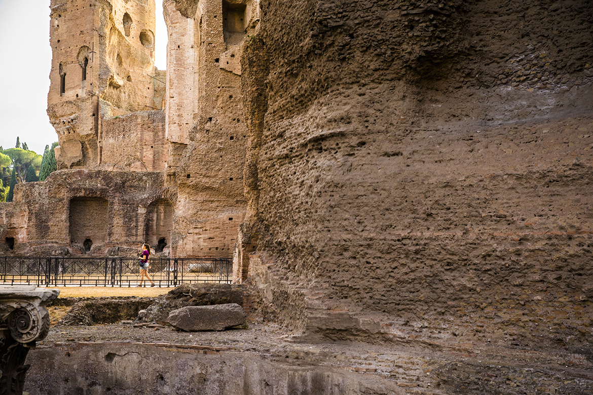 student walking near arches at baths of caracalla