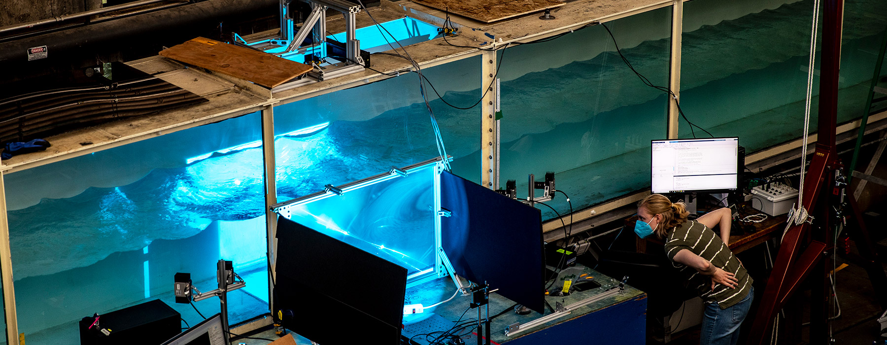 Postdoctoral researcher Luci Baker tracks the behavior of microplastics in the UW Harris Hydraulics Laboratory. Dennis Wise/University of Washington