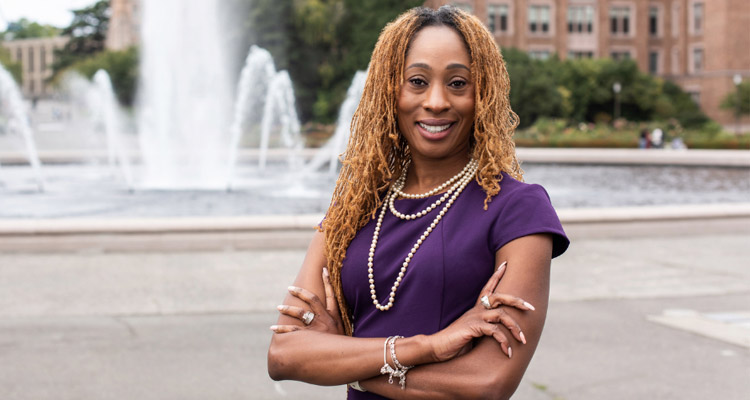 Portrait of Karen Thomas Brown in front of fountain