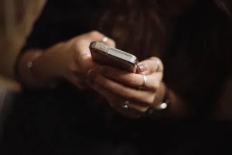 Closeup of female hands holding a smartphone