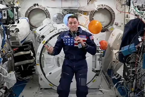Astronaut at the International Space Station talking in front of a camera 